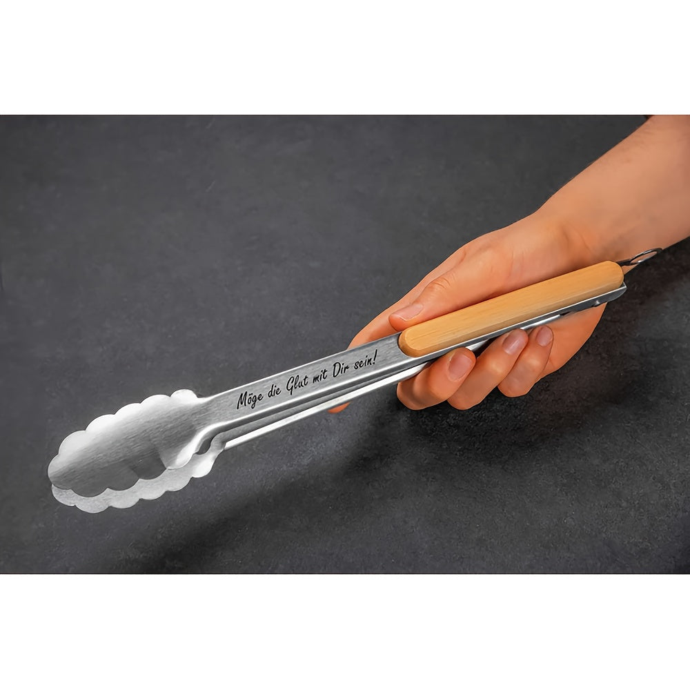 Vasvat braai tongs in hand